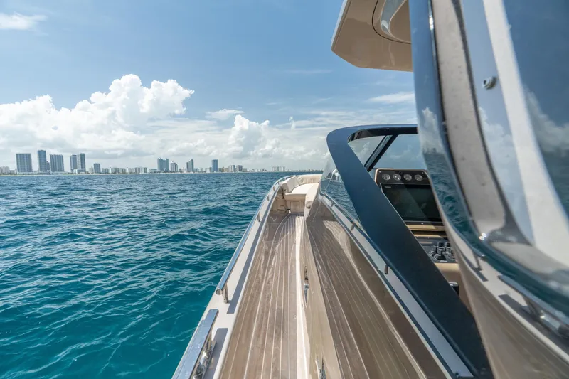 Slide: The Image of Luxurious 2019 CNM Continental 54 yacht cruising near city skyline on a sunny day. - 36