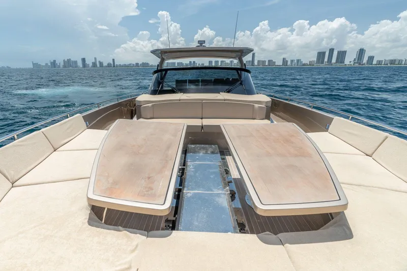 Slide: The Image of Luxurious 2019 CNM Continental 54 yacht with spacious deck, cruising near city skyline. - 4