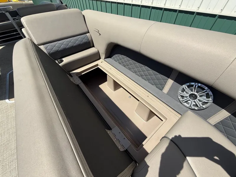 Slide: The Image of Interior of 2018 Bennington 25 SX with storage and speaker. - 15