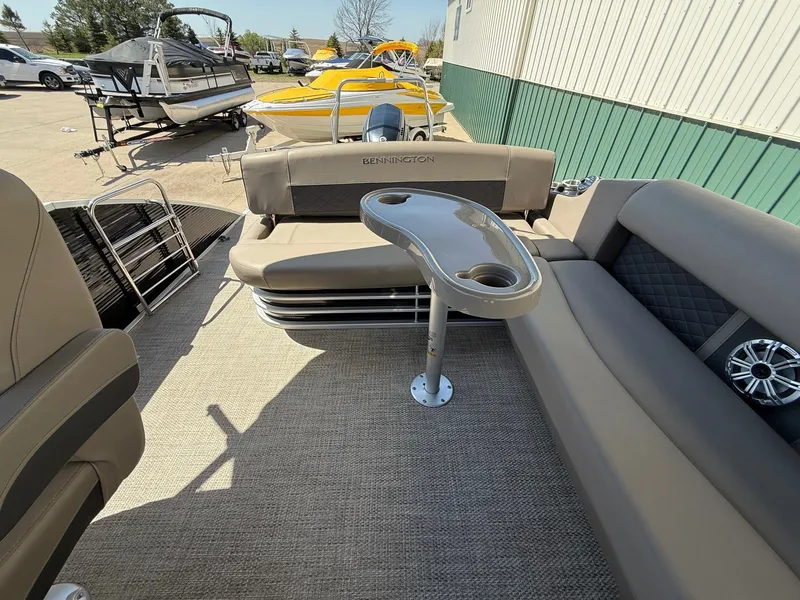 Slide: The Image of Interior of a 2018 Bennington 25 SX pontoon boat with seating area. - 23