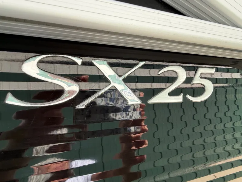 Slide: The Image of Close-up of Bennington 25 SX 2018 boat logo. - 6