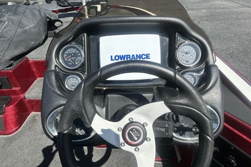 Slide: The Image of Dashboard of a 2014 Triton 19XS boat with Lowrance display and gauges. - 15