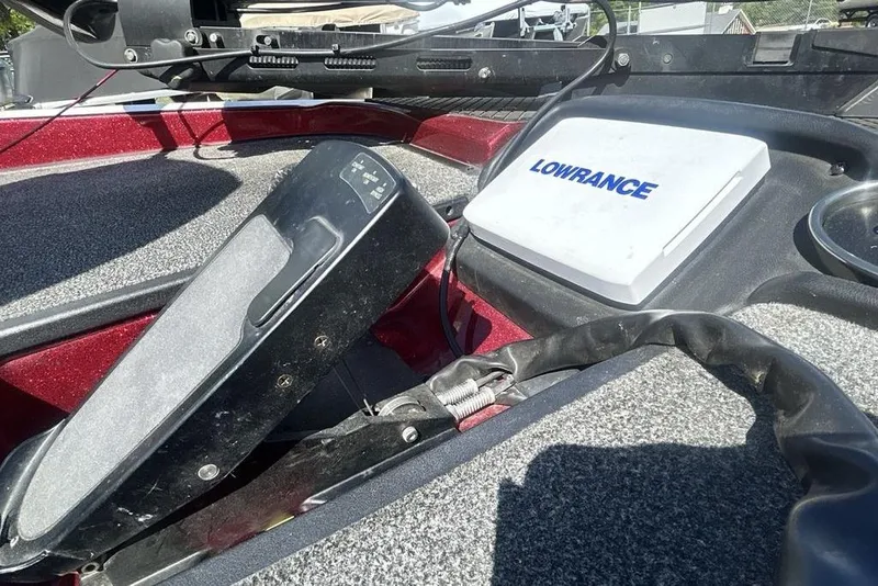 Slide: The Image of 2014 Triton 19XS boat deck featuring Lowrance electronics and foot pedal controls. - 8