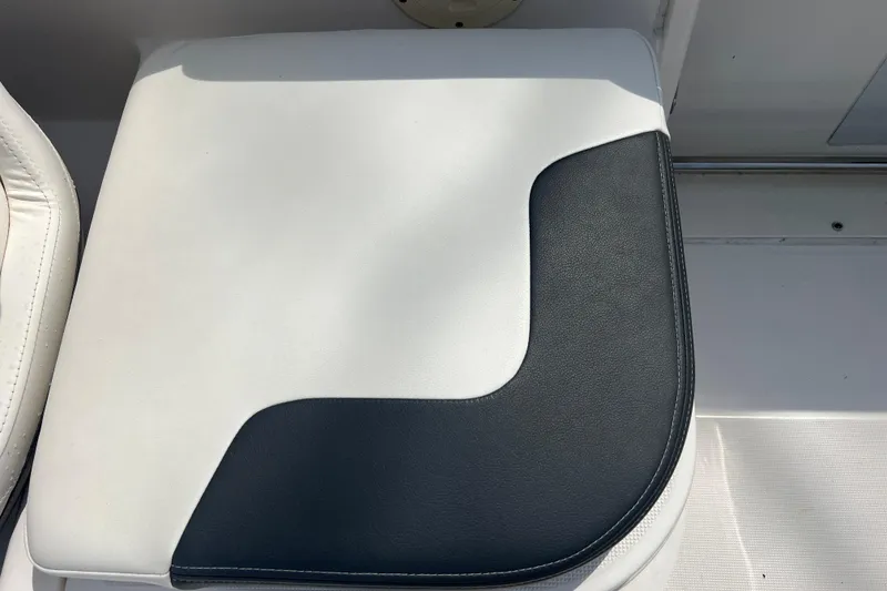 Slide: The Image of White and black seat cushion on 2022 Robalo R227 Dual Console boat. - 20