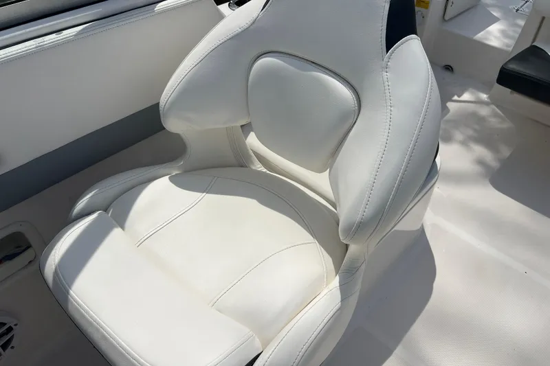 Slide: The Image of White cushioned seat on 2022 Robalo R227 Dual Console boat. - 23