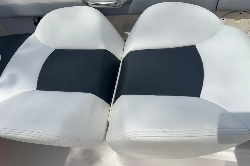 Slide: The Image of White and black seating on 2022 Robalo R227 Dual Console boat. - 25