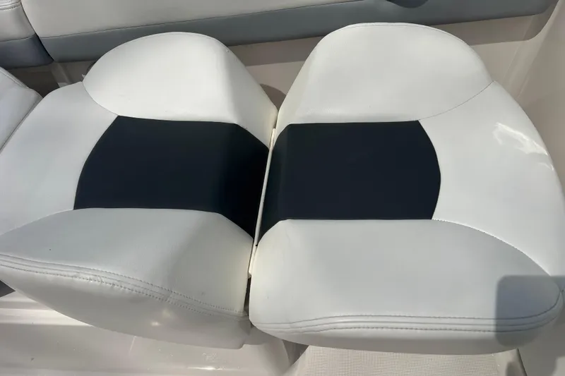 Slide: The Image of White and black seating on 2022 Robalo R227 Dual Console boat. - 26