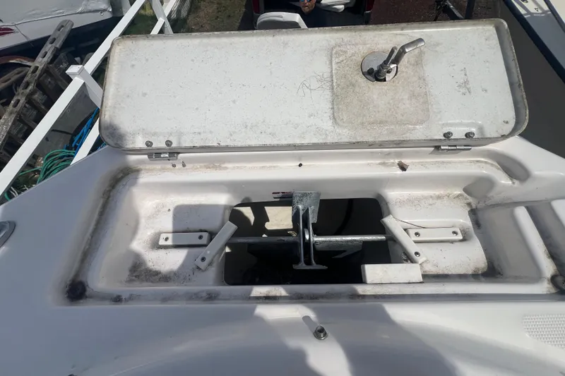 Slide: The Image of Anchor compartment of a 2022 Robalo R227 Dual Console boat. - 31