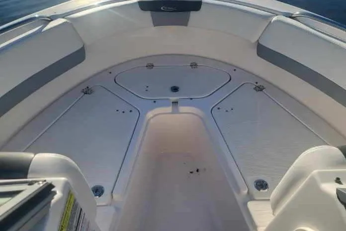 Slide: The Image of 2022 Robalo R227 Dual Console boat interior with spacious seating and storage. - 32