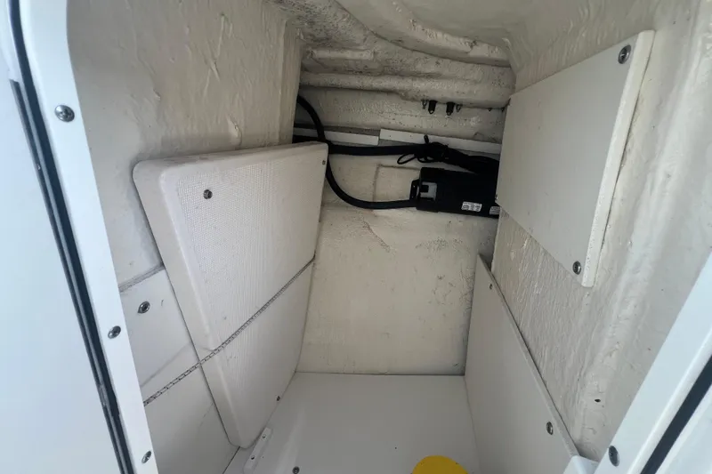 Slide: The Image of Interior storage compartment of 2022 Robalo R227 Dual Console boat. - 39