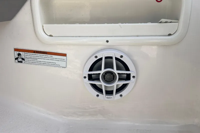 Slide: The Image of 2022 Robalo R227 Dual Console boat speaker and warning label detail. - 46