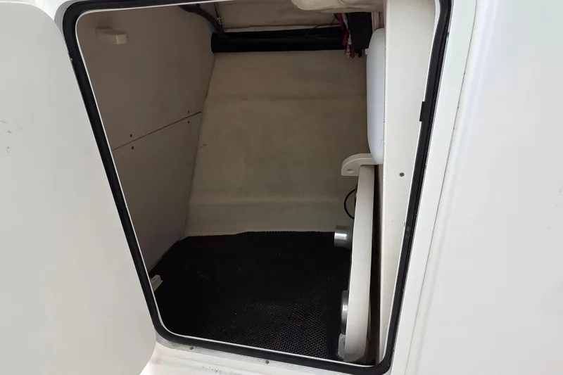 Slide: The Image of 2017 Robalo R247 Dual Console storage compartment interior view. - 14