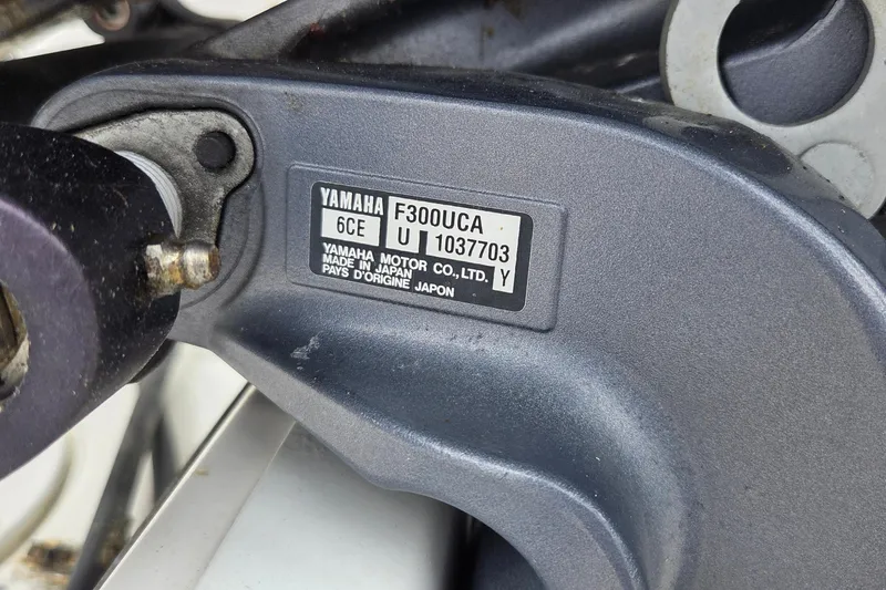 Slide: The Image of Yamaha F300UCA engine label on 2017 Robalo R247 Dual Console boat. - 17