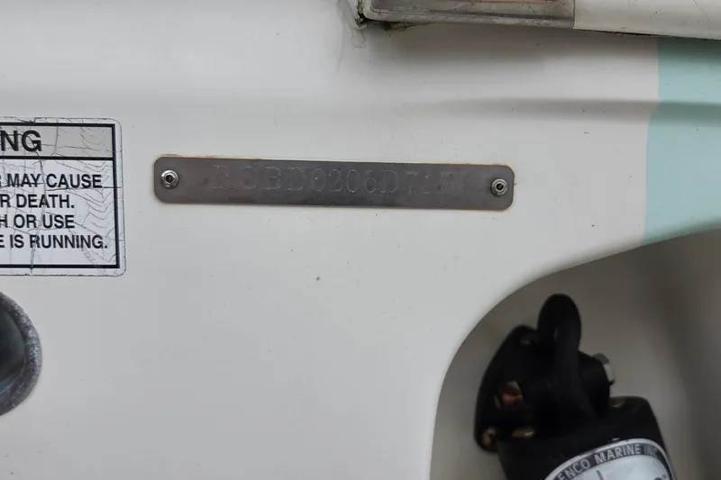 Slide: The Image of 2017 Robalo R247 Dual Console boat identification plate and warning label. - 19