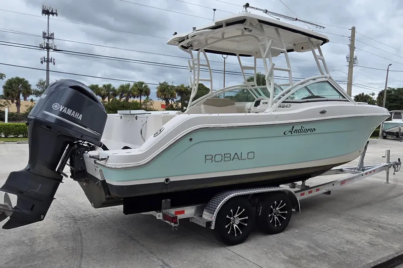 Slide: The Image of 2017 Robalo R247 Dual Console boat on trailer with Yamaha outboard motor. - 3