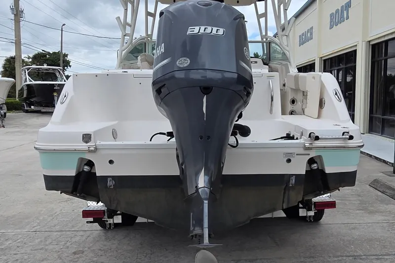 Slide: The Image of 2017 Robalo R247 Dual Console boat with Yamaha 300 engine, parked outside dealership. - 5