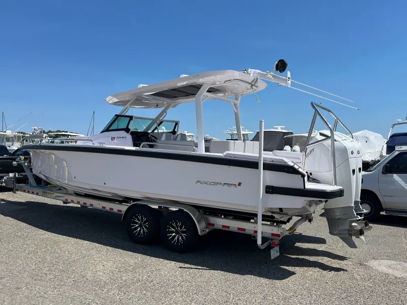 The Image of 2025 Axopar 29 SUN TOP boat on trailer outdoors. - 0