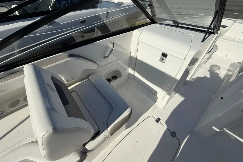Slide: The Image of 2025 Hurricane SunDeck 235 OB boat interior with white seating and sleek design. - 10