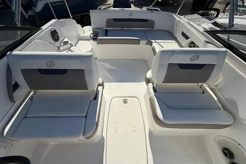 Slide: The Image of 2025 Hurricane SunDeck 235 OB boat interior with spacious seating and modern design. - 12
