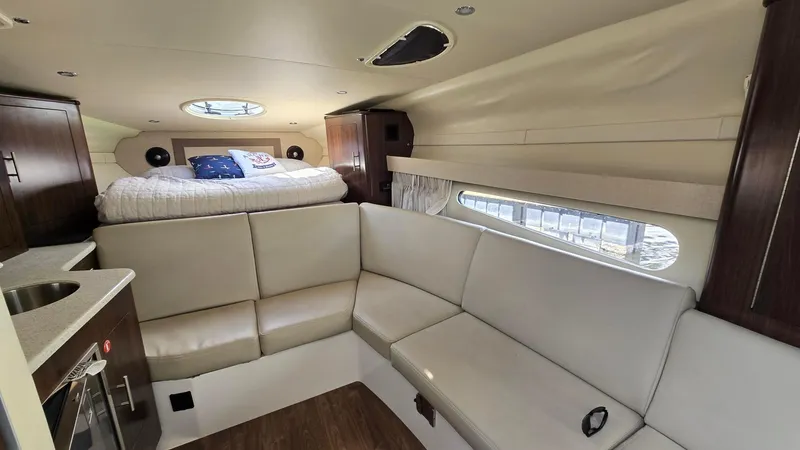 Slide: The Image of Interior of 2017 Regal 32 Express yacht with seating and bed. - 10
