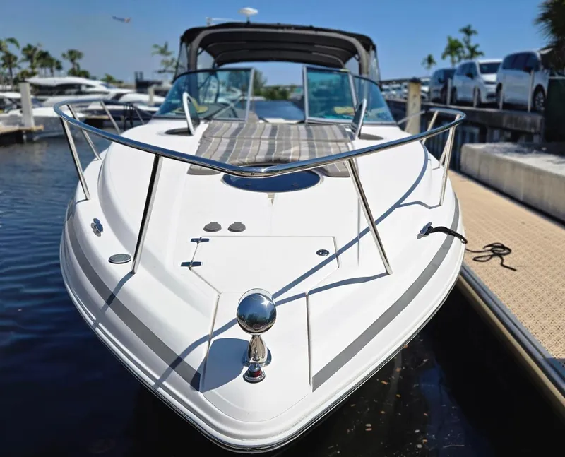 Slide: The Image of 2017 Regal 32 Express boat docked at marina, front view. - 3