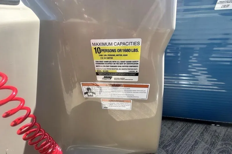 Slide: The Image of 2018 Manitou Aurora LE 22 RF Twin Tube capacity label, 10 persons or 1680 lbs. - 8