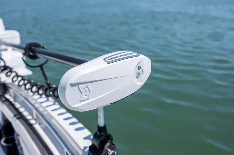 Slide: The Image of 2025 Yamaha Boats 255 FSH Sport H trolling motor on calm water. - 10