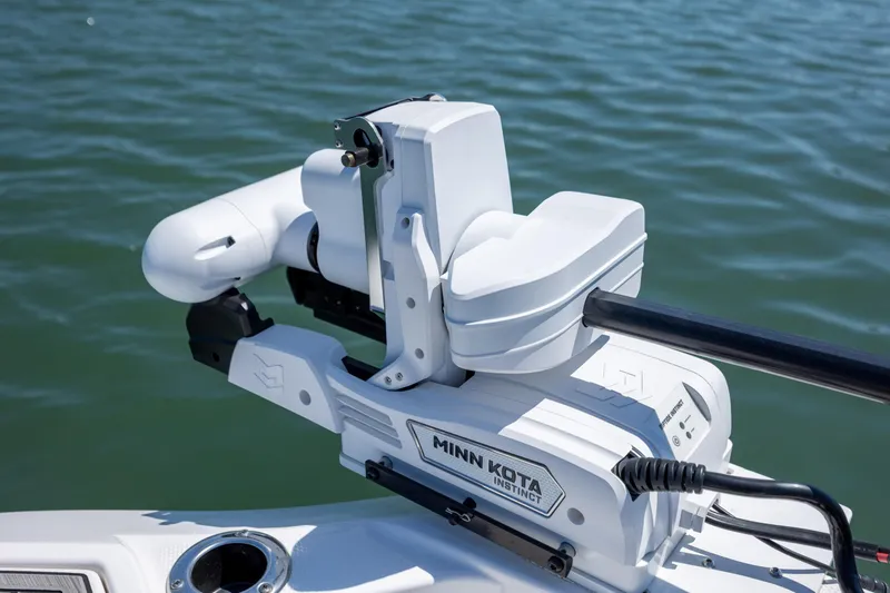 Slide: The Image of Minn Kota Instinct motor on 2025 Yamaha Boats 255 FSH Sport H, on water. - 11