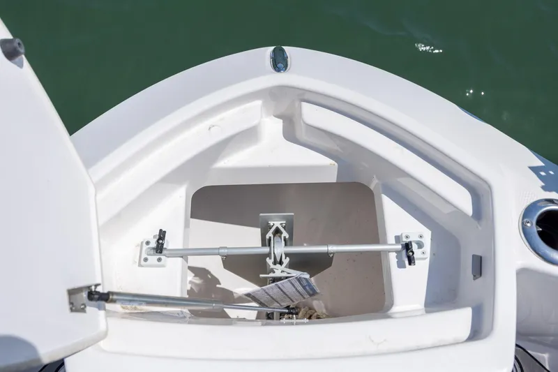 Slide: The Image of Open storage compartment on 2025 Yamaha Boats 255 FSH Sport H, showing interior details. - 12