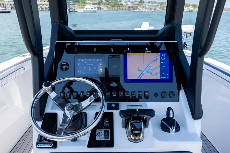 Slide: The Image of 2025 Yamaha Boats 255 FSH Sport H dashboard with navigation and control systems. - 20