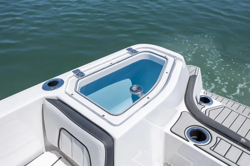 Slide: The Image of 2025 Yamaha Boats 255 FSH Sport H, featuring sleek deck design and water view. - 27