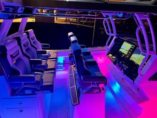 Slide: The Image of 2024 Blackfin 400 CC boat interior with illuminated seating and advanced navigation system. - 12