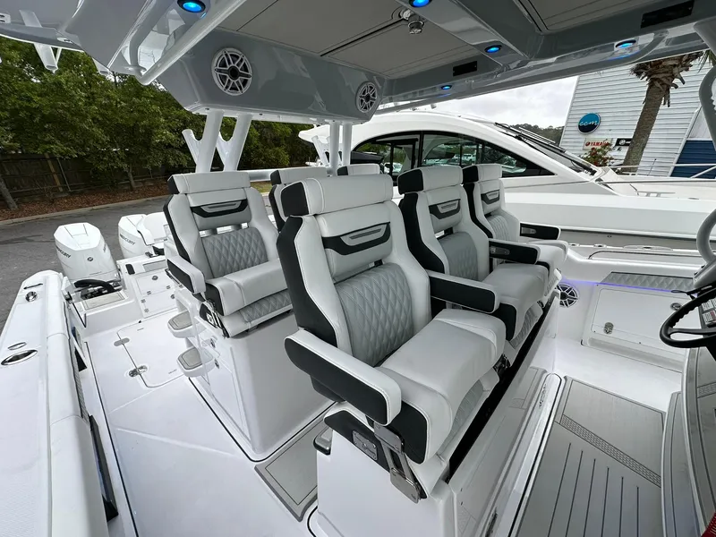 Slide: The Image of 2024 Blackfin 400 CC boat interior with luxurious seating and modern design. - 13