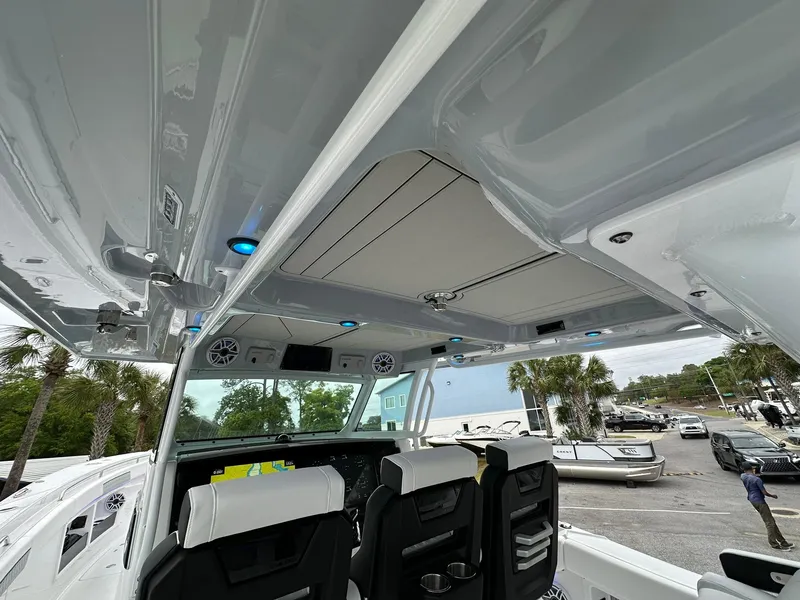 Slide: The Image of 2024 Blackfin 400 CC boat interior with modern seating and advanced controls. - 18