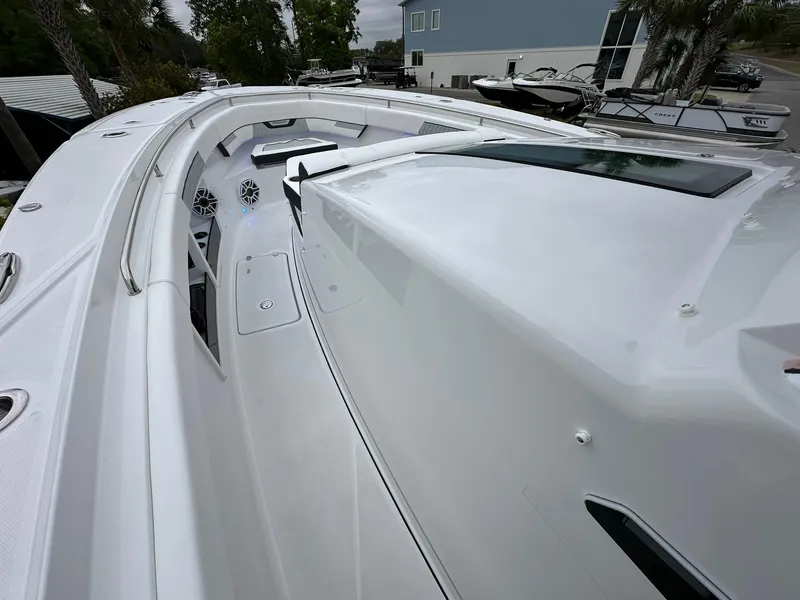 Slide: The Image of 2024 Blackfin 400 CC boat deck with sleek white design. - 20