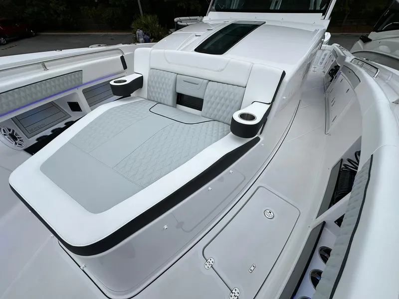 Slide: The Image of 2024 Blackfin 400 CC boat with luxurious seating and cup holders. - 25