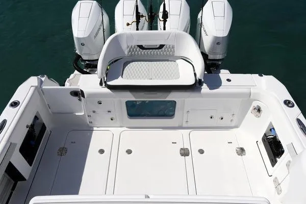 Slide: The Image of 2024 Blackfin 400 CC boat deck with triple outboard engines. - 35