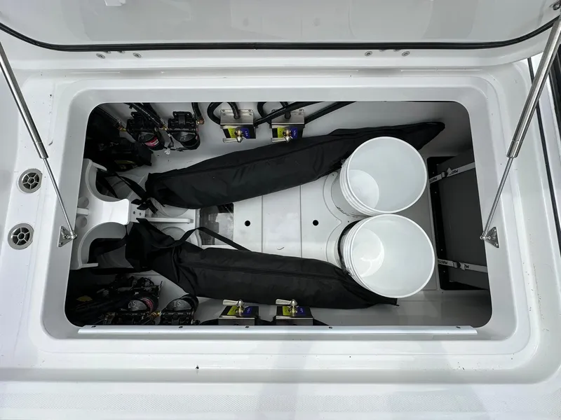 Slide: The Image of 2024 Blackfin 400 CC storage compartment with equipment and buckets. - 44