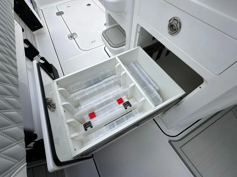 Slide: The Image of Open storage drawer on a 2024 Blackfin 400 CC boat, showcasing organized compartments. - 47