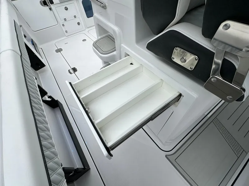 Slide: The Image of 2024 Blackfin 400 CC boat interior with open storage drawer. - 48