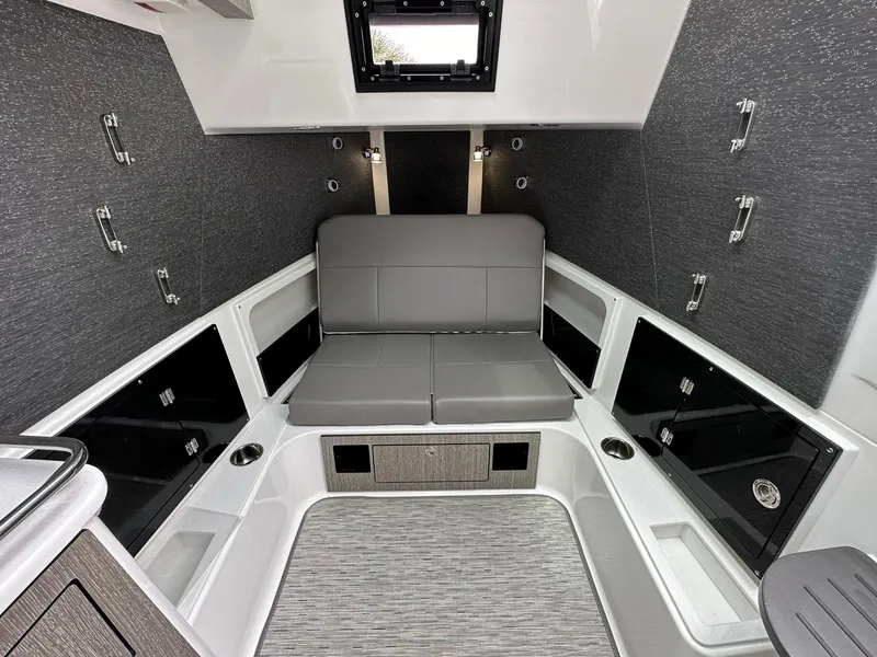 Slide: The Image of 2024 Blackfin 400 CC cabin interior with modern seating and storage compartments. - 49
