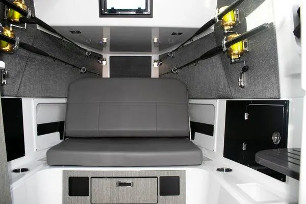 Slide: The Image of Interior of 2024 Blackfin 400 CC boat with seating and fishing rod holders. - 53