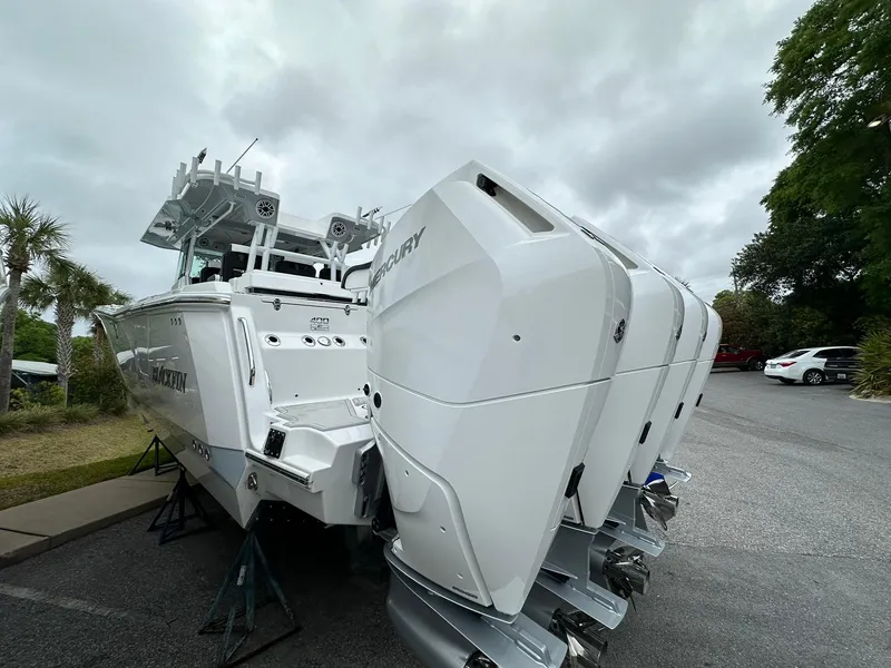 Slide: The Image of 2024 Blackfin 400 CC boat with triple Mercury outboard engines. - 8