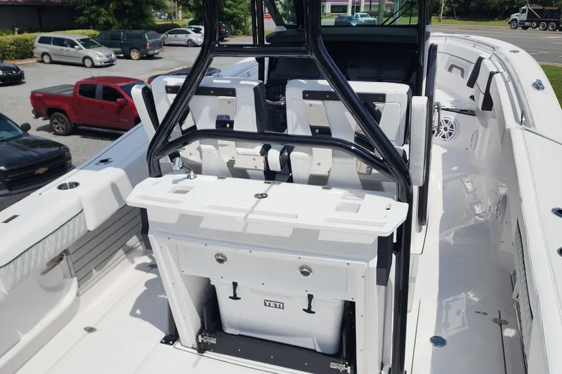 Slide: The Image of 2026 Blackfin 272 CC boat interior with seating and Yeti cooler. - 3
