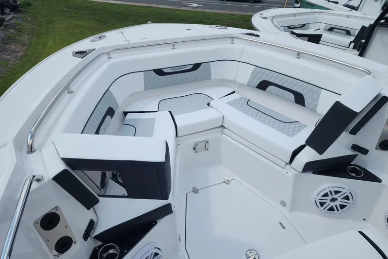 Slide: The Image of 2026 Blackfin 272 CC boat interior with cushioned seating and modern design. - 6