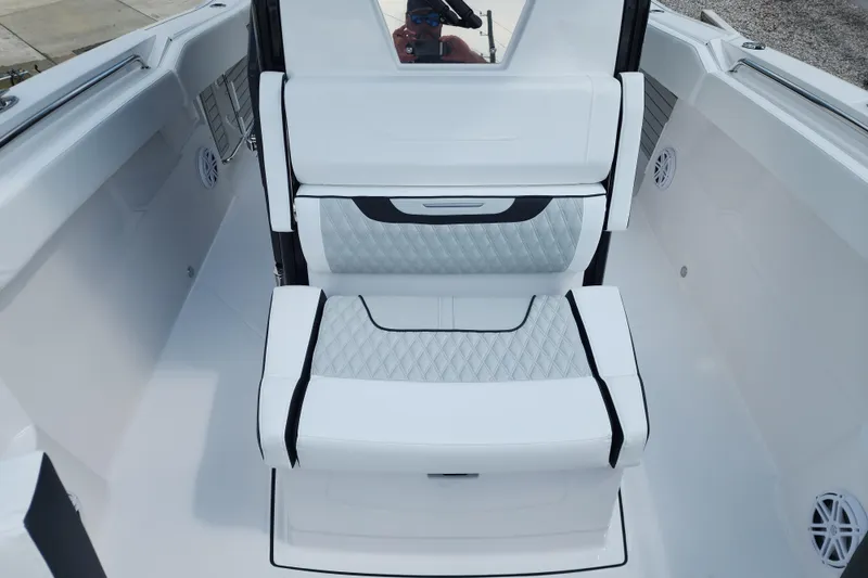 Slide: The Image of 2026 Blackfin 272 CC boat interior with white cushioned seating and modern design. - 8