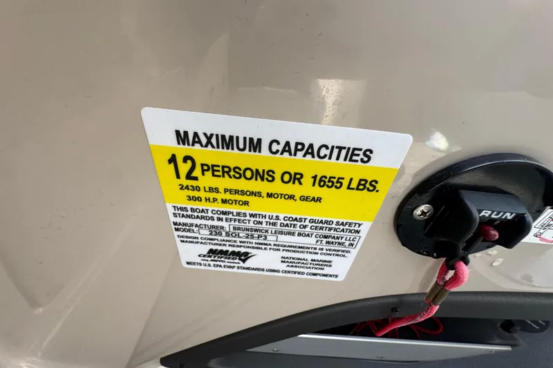 Slide: The Image of Maximum capacity label on 2021 Harris Solstice 230 boat, 12 persons or 1655 lbs. - 15