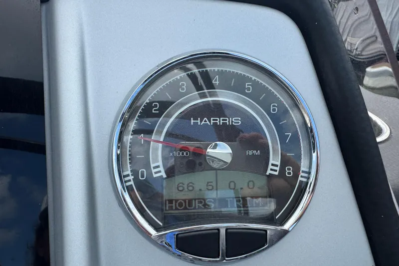 Slide: The Image of Close-up of 2021 Harris Solstice 230 tachometer displaying 66.5 hours. - 16