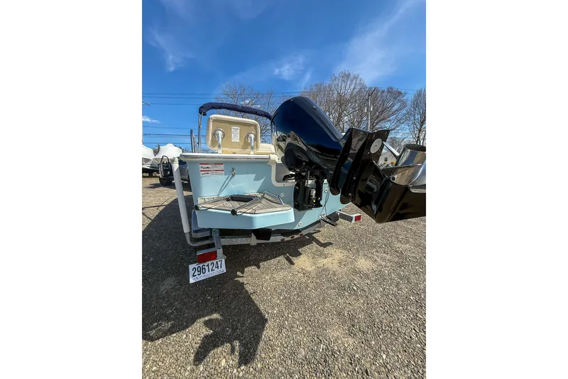 Slide: The Image of 2025 Boston Whaler 190 Montauk boat rear view with outboard motor. - 4