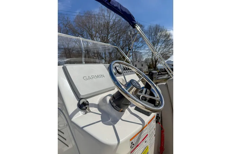 Slide: The Image of Steering console of 2025 Boston Whaler 190 Montauk with Garmin navigation system. - 6